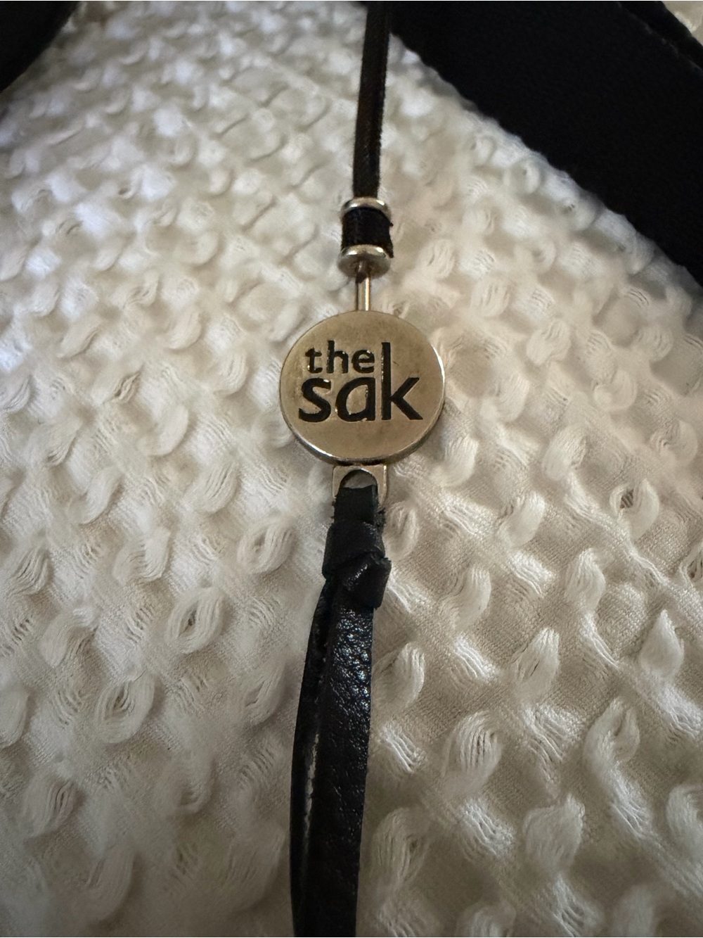 The Sak Black Leather Cord Necklace with Logo Medallion